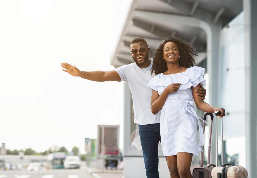 Passengers hailing a taxi.